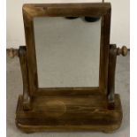 A Victorian pine dressing table swing mirror.