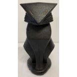 An Art Deco style black painted cast iron doorstop in the shape of a cat.