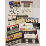 A collection of 11 Royal Mail stamp presentation packs together with a stamp album.