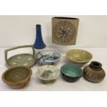 9 pieces of studio pottery, some with pottery marks. To include vases, bowls and dishes.