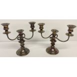 A pair of welsh silver plated on copper, 2 sectional candelabra's with twist arm design.