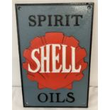 A Shell painted cast iron wall plaque with fixing holes.