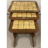 A nest of 3 tile topped tables by G Plan with original label.