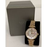 A boxed women's gold tone bracelet wristwatch by Emporio Armani.