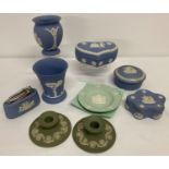 A collection of Wedgwood Jasper ware ceramic items to include lighter, trinket pots and vases.