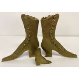 2 vintage brass vases in the shape of ladies Victorian button up boots.