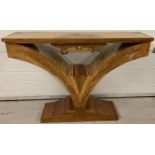 An Art Deco style V shaped console table with marquetry detail to top and central drawer.