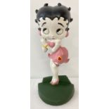 A painted cast iron doorstop in the shape of Betty Boop.