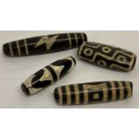 4 Tibetan dzi agate beads.