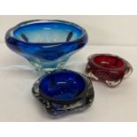 3 pieces of art glass. A large blue bowl together with a blue ashtray and a red ashtray.
