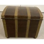 A vintage dark wood and brass banded fireside box complete with liner and carry handles.