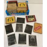 A quantity of assorted boxed vintage glass negative plates.