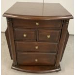A modern style mahogany side table/cabinet with 5 drawers and magazine rack to each side.