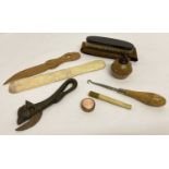 A collection of assorted misc. items to include a Victorian cast iron bull head can opener.