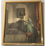 A vintage framed and glazed print of two women in Victorian dress doing needlework.