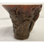 A heavily carved Chinese libation cup with signature to base.