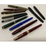 A collection of 11 fountain pens in varying conditions.