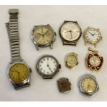 A collection of vintage watches mostly with out straps.