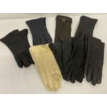 A collection of vintage leather and synthetic ladies gloves.