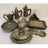 A box of silver plate and pewter items to include coffee pots and serving dishes.