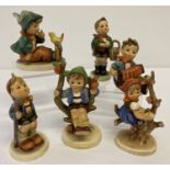 6 vintage Goebel ceramic Hummel figurines of children, dating from the 1950's.