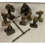 8 metal vintage car jacks in varying sizes and condition.
