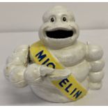 A painted cast metal advertising Michelin man mechanical money box.