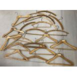 22 vintage wooden advertising coat hangers for tailors, hotels and cleaners.