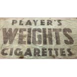A vintage printed canvas wall hanging sign for "Player's Weights Cigarettes".