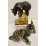 2 ceramic Russian Lamonosov animal figurines. A tiger cub and a bear balancing on a drum.