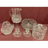 A collection of lead crystal items to include water jug, lidded barrel, basket and candlesticks.