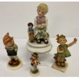 A Ltd Edition Goebel Lore figurine of a girl with her doll together with 3 Goebel Hummel figures.