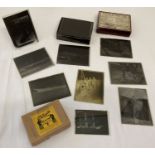 A quantity of vintage glass negative plates of ships and boats.