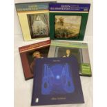 4 boxed sets of Haydn Symphonies by Decca. Together with a "Blue Guitars" book & CD's by Chris Rea.