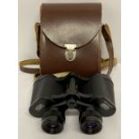 A pair of Carl Zeiss Jena multi-coated Jenoptem 8 x 30W binoculars with leather strap.