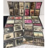 An album containing 180+ vintage postcards, photos and greetings cards.