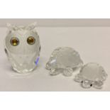 A vintage Swarovski Crystal owl figurine together with 2 tortoise figures.