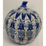 A large vintage Chinese ceramic blue and white lidded pumpkin jar.