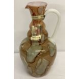 A Lavorazione Italian Murano glass jug in brown and gold tones.