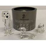 1 boxed and 2 unboxed Swarovski Crystal dog figurines.