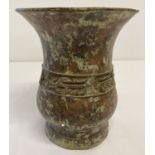 An Archaic Chinese bronze vase of bulbous form with wide lipped mouth.