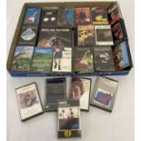 A collection of 35 music cassette tapes.