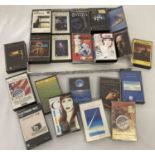 A collection of 26 musical cassette tapes.