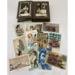 A vintage postcard album containing over 90 antique and vintage postcards mostly greetings cards.