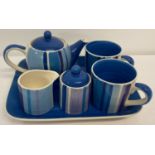 A ceramic tea for two set by Whittard in a blue and lilac stripe pattern.