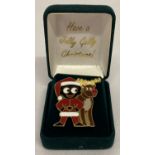 A boxed "Have A Jolly Golly Christmas" Golly badge by Robertson's.