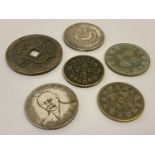 A collection of 6 assorted Chinese coins and tokens to include large coin with square shaped hole.