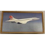 A framed and glazed print of Concorde.