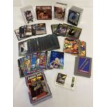 A box of assorted boxed and unboxed trading cards.