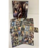 A folder containing a large quantity of The X Files trading cards from Topps.